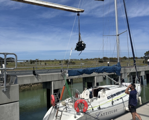 A new marine engine being installed in a sailing yacht.